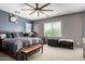 Spacious bedroom with a ceiling fan, large windows, and neutral-toned walls at 2489 E Sequoia Dr, Chandler, AZ 85286