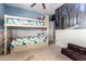Fun bedroom featuring bunk beds, a ceiling fan, and a muraled wall at 2489 E Sequoia Dr, Chandler, AZ 85286