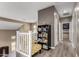 Upstairs hallway with neutral tones and cozy reading nook at 2489 E Sequoia Dr, Chandler, AZ 85286