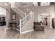 Open-concept living room with high ceilings and hardwood floors, bright and airy at 2489 E Sequoia Dr, Chandler, AZ 85286