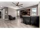Cozy living room with a wooden accent wall and comfortable seating, designed for relaxation at 2489 E Sequoia Dr, Chandler, AZ 85286