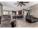 Open concept living room and kitchen with breakfast bar and modern finishes at 2489 E Sequoia Dr, Chandler, AZ 85286