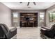 Inviting living room featuring a wooden accent wall and comfortable seating at 2489 E Sequoia Dr, Chandler, AZ 85286
