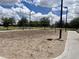 Community outdoor sand volleyball court surrounded by landscaping and trees for recreation at 2489 E Sequoia Dr, Chandler, AZ 85286