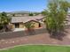 An aerial view of the backyard of this home, with desert landscaping, and a patio at 25087 W Dove Gap Dr, Buckeye, AZ 85326