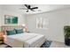 Tastefully staged bedroom featuring a comfortable bed, art, and natural light at 25087 W Dove Gap Dr, Buckeye, AZ 85326