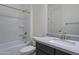 Bathroom featuring a single sink vanity with granite countertops and tub shower at 257 S 165Th Ave, Goodyear, AZ 85338