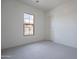 Neutral bedroom with plush carpeting and a view from the window at 257 S 165Th Ave, Goodyear, AZ 85338