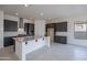 Modern kitchen featuring stainless steel appliances, a large center island, and stylish cabinetry at 257 S 165Th Ave, Goodyear, AZ 85338