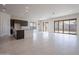 Spacious living room offers ample natural light, tile floors, and access to outdoor living space at 257 S 165Th Ave, Goodyear, AZ 85338