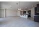 Open-concept living area with tile flooring, recessed lighting, and seamless flow to the kitchen at 257 S 165Th Ave, Goodyear, AZ 85338