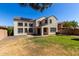 Spacious backyard featuring a well-maintained lawn and a patio perfect for outdoor gatherings at 2718 S Cupertino Dr, Gilbert, AZ 85295