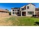 Exterior of home with landscaped backyard and solar panels on the roof at 2718 S Cupertino Dr, Gilbert, AZ 85295