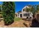Exterior of home with landscaped backyard, and partial shade trees at 2718 S Cupertino Dr, Gilbert, AZ 85295