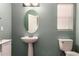 View of half bathroom with white sink and toilet and window at 2718 S Cupertino Dr, Gilbert, AZ 85295