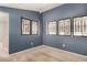 Bedroom featuring carpet and a window with security bars for added protection at 2718 S Cupertino Dr, Gilbert, AZ 85295