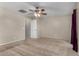 View of bedroom with carpet flooring and ceiling fan and open door at 2718 S Cupertino Dr, Gilbert, AZ 85295