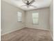 Bedroom featuring carpet and large windows to let in plenty of natural light at 2718 S Cupertino Dr, Gilbert, AZ 85295