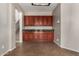 Bright dining area with tile floors, modern light fixture and convenient access to the kitchen and staircase at 2718 S Cupertino Dr, Gilbert, AZ 85295