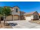 Charming home with a three-car garage and lush desert landscaping, complete with a private gated courtyard at 2718 S Cupertino Dr, Gilbert, AZ 85295