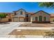 Charming home with a three-car garage and lush desert landscaping, complete with a private gated courtyard at 2718 S Cupertino Dr, Gilbert, AZ 85295