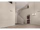 Spacious living room with high ceilings, carpet floors, pendant lighting and an open floor plan at 2718 S Cupertino Dr, Gilbert, AZ 85295