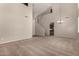 Spacious living room with high ceilings, carpet floors, pendant lighting and an open floor plan at 2718 S Cupertino Dr, Gilbert, AZ 85295