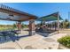 Shaded playground with picnic tables offers a fun and relaxing space for families to gather at 2718 S Cupertino Dr, Gilbert, AZ 85295