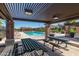 Relax in the shade at the community pool area with picnic tables and a beautiful pool view at 2718 S Cupertino Dr, Gilbert, AZ 85295