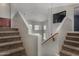 Carpeted staircase with unique architectural design and natural light at 2718 S Cupertino Dr, Gilbert, AZ 85295