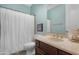 Bathroom with blue walls, a white shower curtain, and neutral vanity at 2856 E Desert Broom Pl, Chandler, AZ 85286