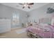 Bedroom with pink accents, a vanity, and a metal-framed bed at 2856 E Desert Broom Pl, Chandler, AZ 85286