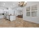 Open concept view of the kitchen and dining area with natural light and tile flooring at 2856 E Desert Broom Pl, Chandler, AZ 85286