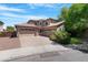 Beautiful two-story home with a three-car garage and a well-maintained desert landscape at 2856 E Desert Broom Pl, Chandler, AZ 85286