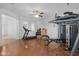 Bright gym with exercise equipment, white walls, and a ceiling fan at 2856 E Desert Broom Pl, Chandler, AZ 85286