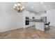 Open concept view of the kitchen with stainless appliances and an island with bar seating at 2856 E Desert Broom Pl, Chandler, AZ 85286