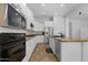 Bright kitchen features stainless appliances, granite countertops, and white cabinetry at 2856 E Desert Broom Pl, Chandler, AZ 85286