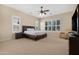 Spacious main bedroom features lots of natural light, neutral walls and carpet at 2856 E Desert Broom Pl, Chandler, AZ 85286