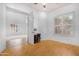 Office space with wood flooring, large windows, and a closet for added storage at 2856 E Desert Broom Pl, Chandler, AZ 85286