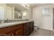 Bathroom boasts granite counters, dark wood cabinets, large mirror and tiled shower at 30617 N 138Th Way, Scottsdale, AZ 85262