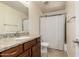 Bathroom features granite counters, dark cabinets and a shower-tub combo at 30617 N 138Th Way, Scottsdale, AZ 85262
