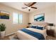 Bedroom with bright window, neutral decor, and area rug at 30617 N 138Th Way, Scottsdale, AZ 85262