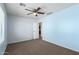 Bedroom features blue walls, a ceiling fan, and neutral carpet at 30617 N 138Th Way, Scottsdale, AZ 85262
