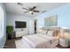 Blue bedroom with television and neutral decorations at 30617 N 138Th Way, Scottsdale, AZ 85262