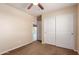 Bedroom features neutral carpet, double door closet and a door leading to the backyard at 30617 N 138Th Way, Scottsdale, AZ 85262