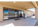 Covered patio features a built-in gas grill and sliding glass doors to seamlessly connect indoor and outdoor living spaces at 30617 N 138Th Way, Scottsdale, AZ 85262
