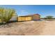 Backyard view with a shed, privacy fence, and access to the home's garage at 30617 N 138Th Way, Scottsdale, AZ 85262