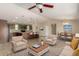 Spacious living room with kitchen, dining, and seating areas at 30617 N 138Th Way, Scottsdale, AZ 85262