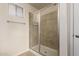 Bathroom features a shower with tile surround and glass sliding doors at 30617 N 138Th Way, Scottsdale, AZ 85262