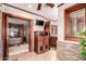 Bathroom with a view of the bedroom and stone walls at 325 E Sharon Ave, Phoenix, AZ 85022